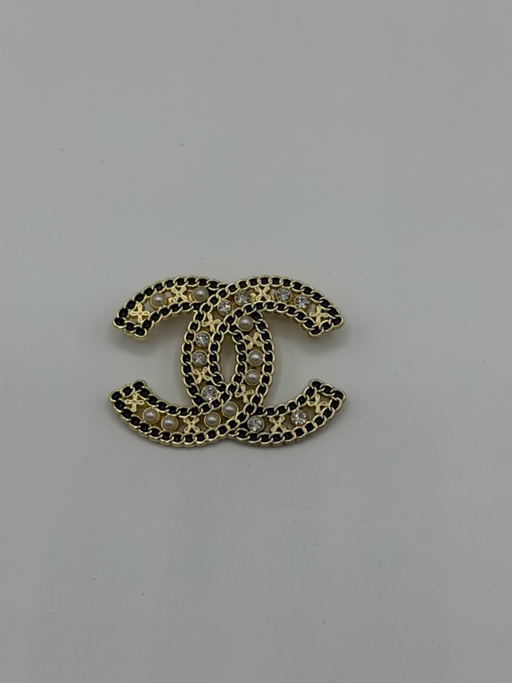 Gold-Tone Interlocking Logo Brooch with Pearls and Crystals